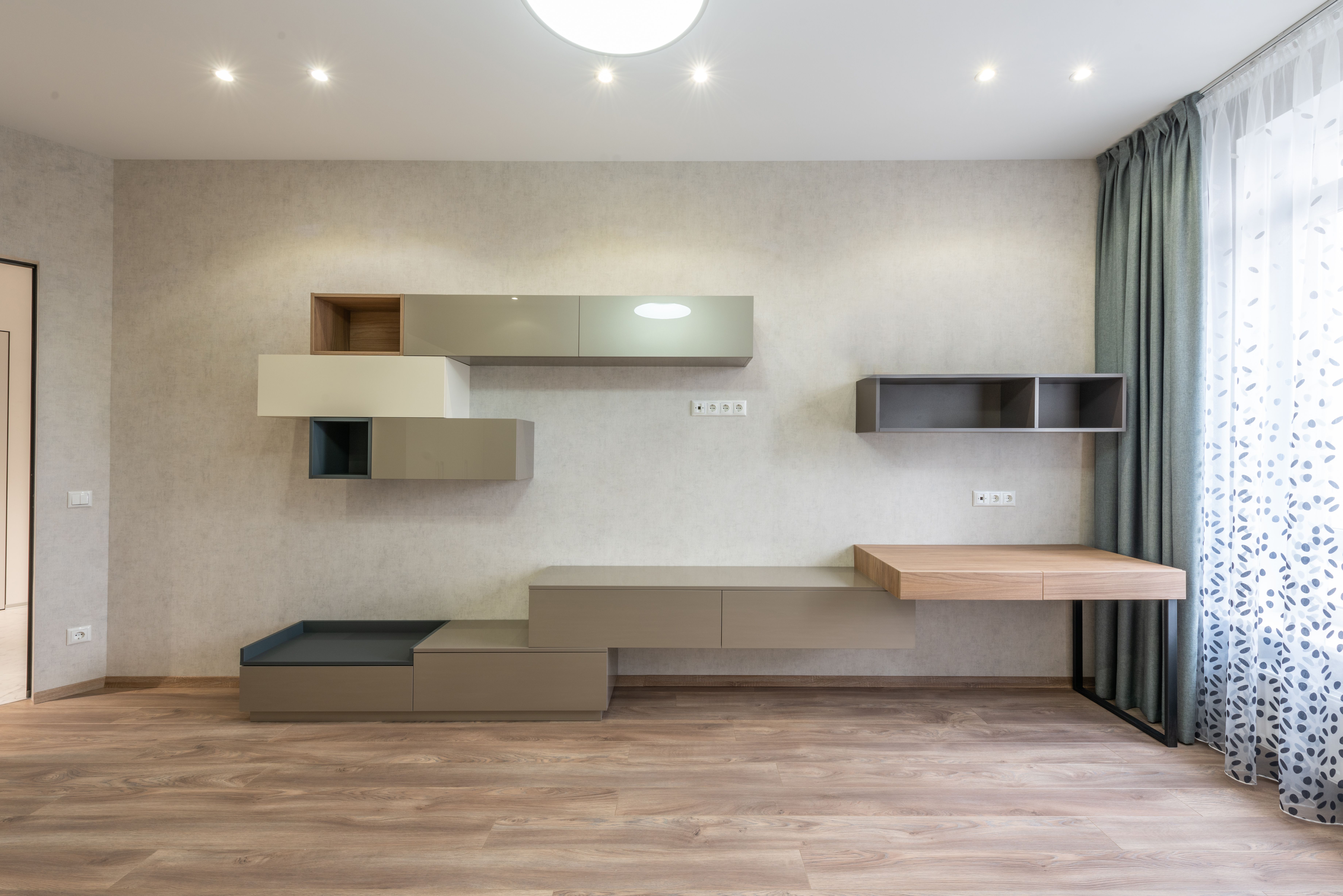 TV unit with wall paneling by Duly Decors, Chennai